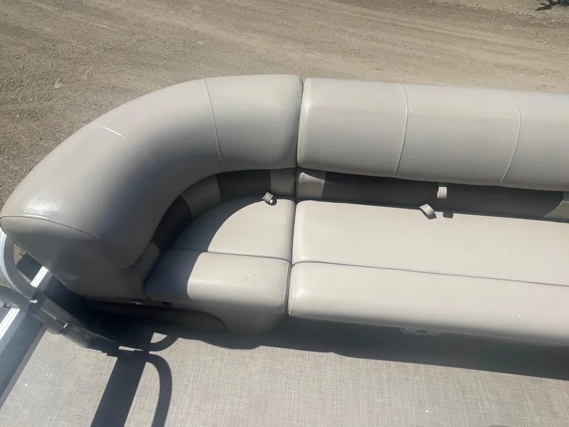 Slide: The Image of Sun Tracker SportFish 22 XP3 2023 pontoon boat with gray cushioned seating. - 6