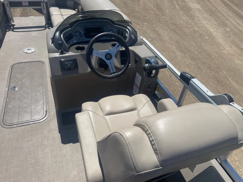 Slide: The Image of 2023 Sun Tracker SportFish 22 XP3 boat interior with steering console and seating. - 8
