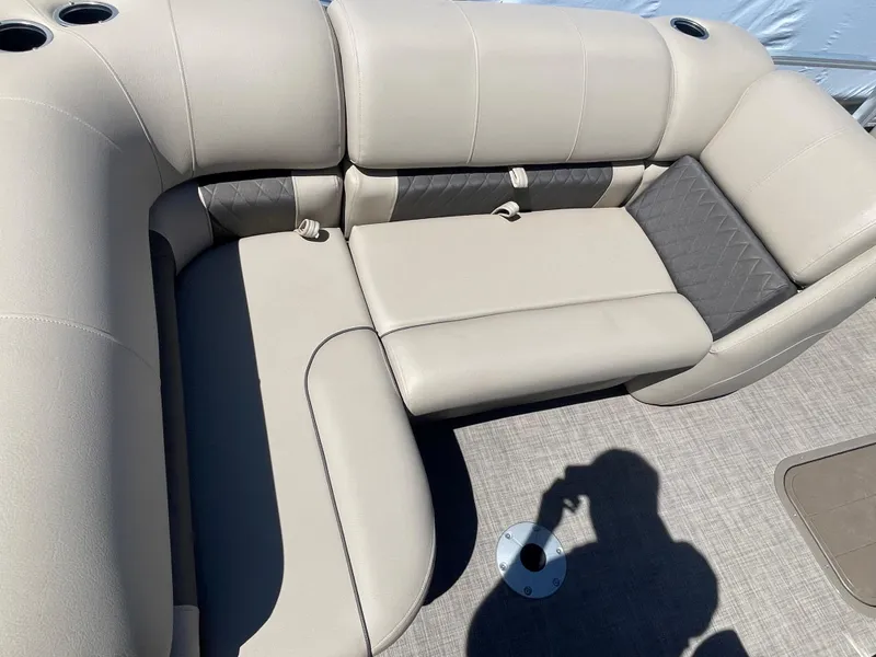 Slide: The Image of 2022 Sun Tracker SportFish 22 XP3 boat interior seating area with beige upholstery. - 18