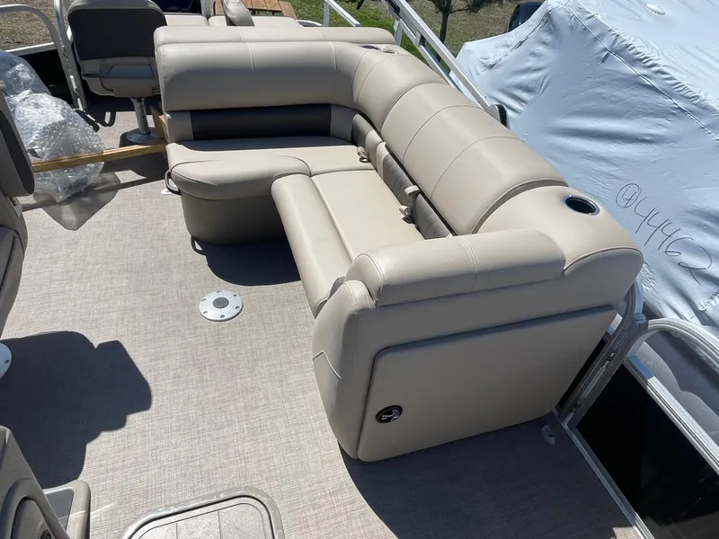 Slide: The Image of 2022 Sun Tracker SportFish 22 XP3 pontoon boat with beige seating. - 9