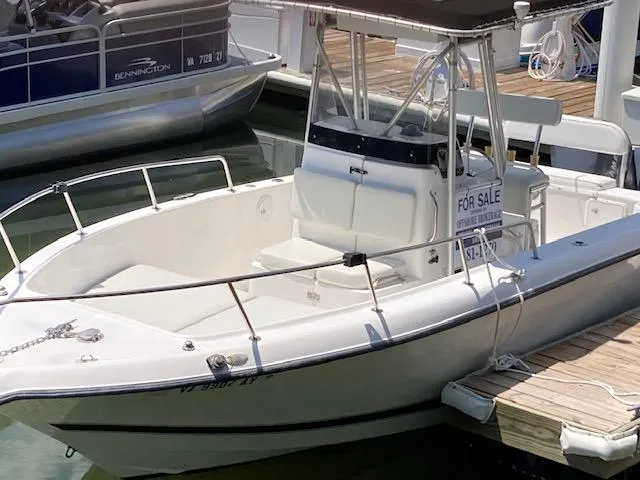 Slide: The Image of 1998 Century 2300 Center Console boat for sale docked at marina. - 11