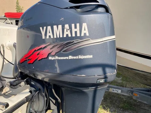Slide: The Image of Yamaha outboard motor on a 1998 Century 2300 Center Console boat. - 14