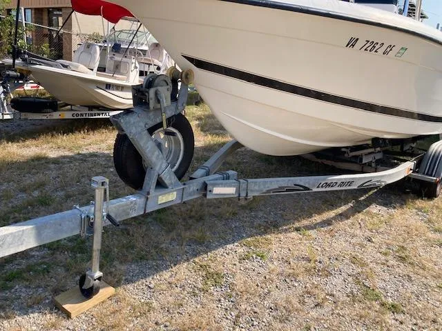 Slide: The Image of 1998 Century 2300 Center Console boat on Load Rite trailer. - 20