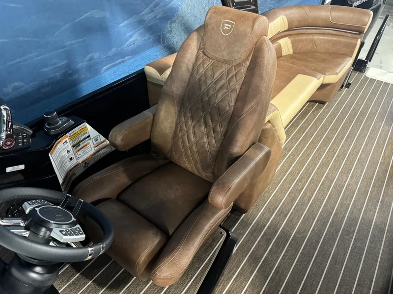 Slide: The Image of 2025 Premier 270 Super Sport RF boat interior with luxurious brown leather seating. - 12