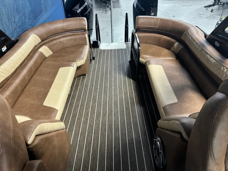 Slide: The Image of 2025 Premier 270 Super Sport RF interior with luxurious brown seating and striped flooring. - 16
