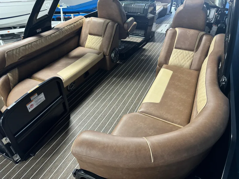Slide: The Image of Luxurious interior of 2025 Premier 270 Super Sport RF boat with brown leather seating. - 17