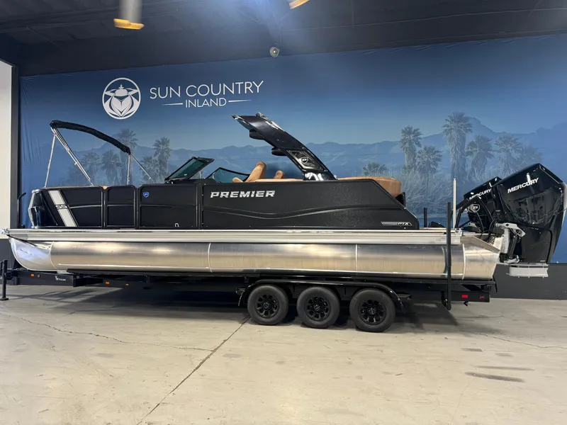 Slide: The Image of 2025 Premier 270 Super Sport RF pontoon boat displayed indoors at Sun Country Inland. - 2