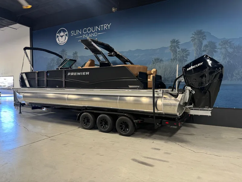 Slide: The Image of 2025 Premier 270 Super Sport RF pontoon boat displayed indoors on a trailer. - 3