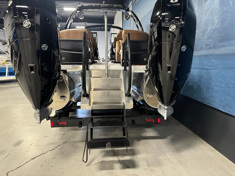 Slide: The Image of 2025 Premier 270 Super Sport RF boat with dual engines, rear view in showroom. - 5