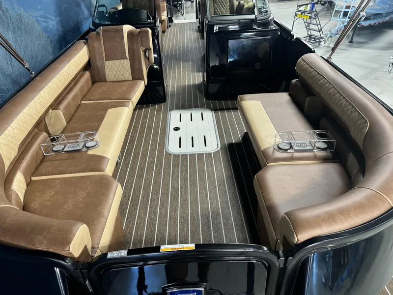 Slide: The Image of Luxurious interior of 2025 Premier 270 Super Sport RF boat with plush seating and cup holders. - 7