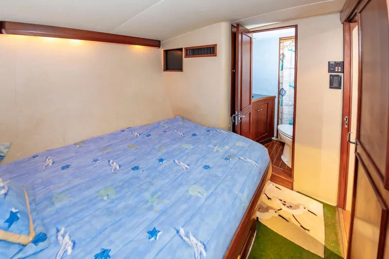 Slide: The Image of Bedroom and bathroom interior of a 1993 Jarrett Bay Convertible yacht. - 37