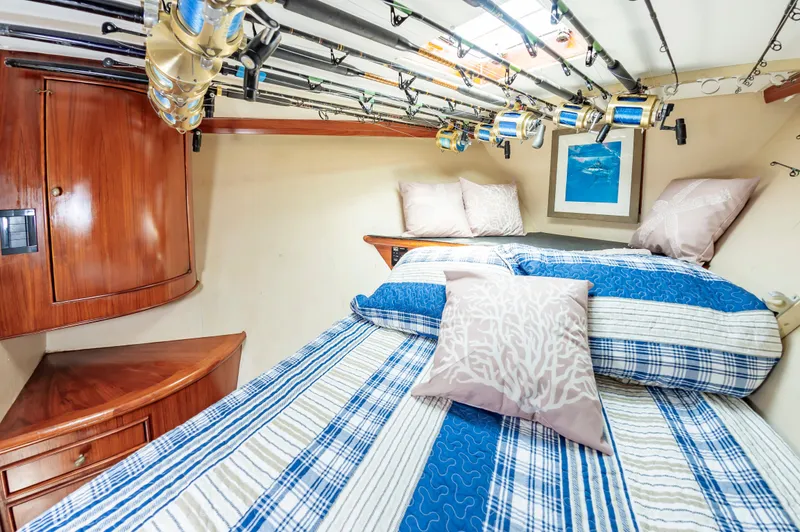 Slide: The Image of Cozy cabin interior of 1993 Jarrett Bay Convertible with fishing rods and nautical decor. - 47