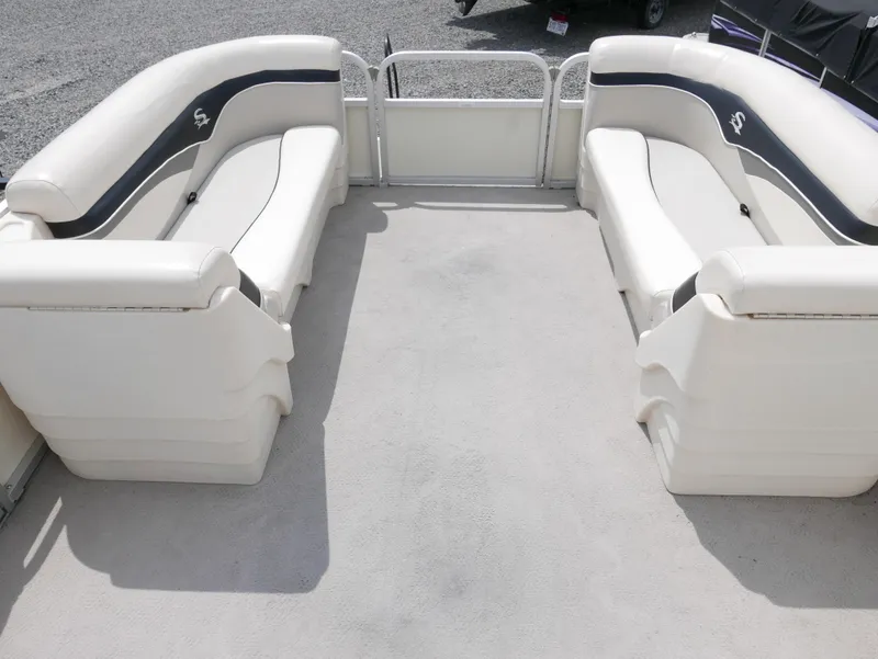 Slide: The Image of 2007 Sedona L23 boat interior with white seating and gray accents. - 4