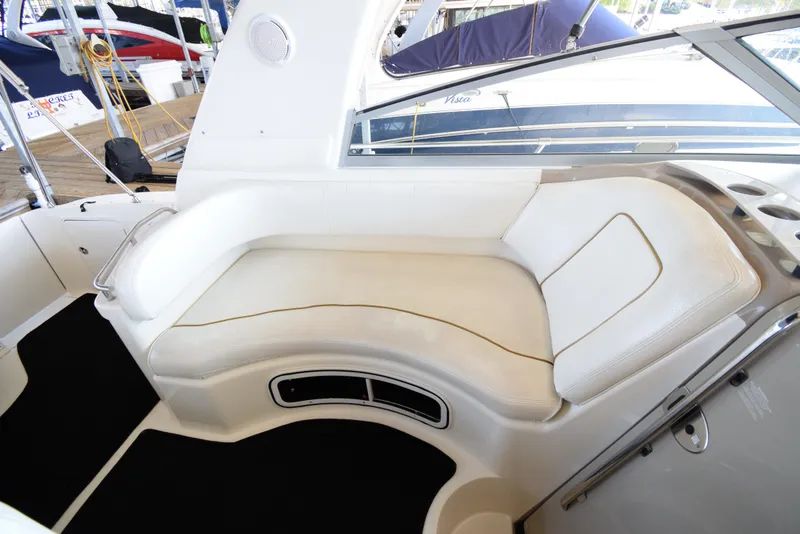 Slide: The Image of 1999 Sea Ray 290 Sundancer interior seating area with white leather upholstery. - 15