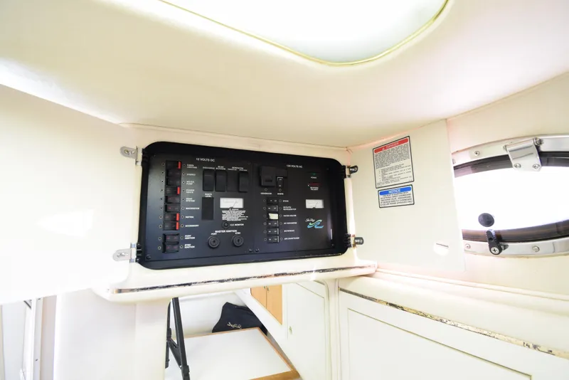 Slide: The Image of Electrical control panel inside 1999 Sea Ray 290 Sundancer boat cabin. - 35