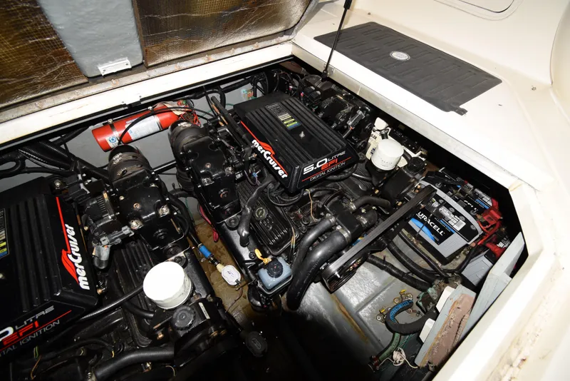 Slide: The Image of Engine compartment of a 1999 Sea Ray 290 Sundancer with MerCruiser engines. - 38