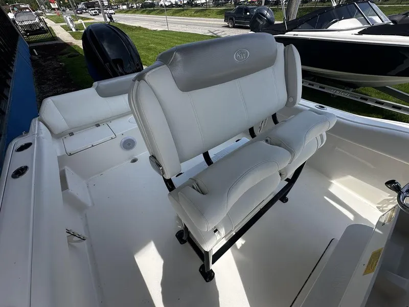 Slide: The Image of 2024 Key West 239 FS boat interior with white seating and clean deck. - 5