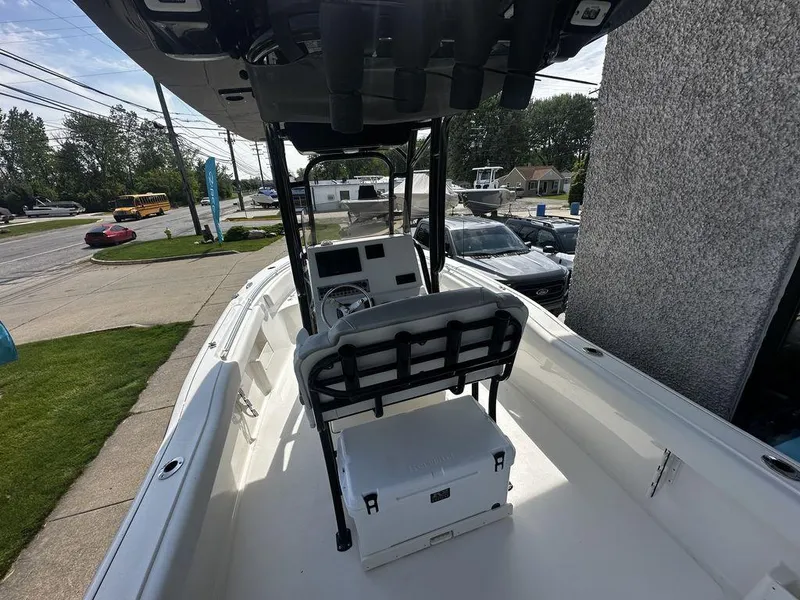 Slide: The Image of 2024 Key West 239 FS boat interior with seating and console. - 8