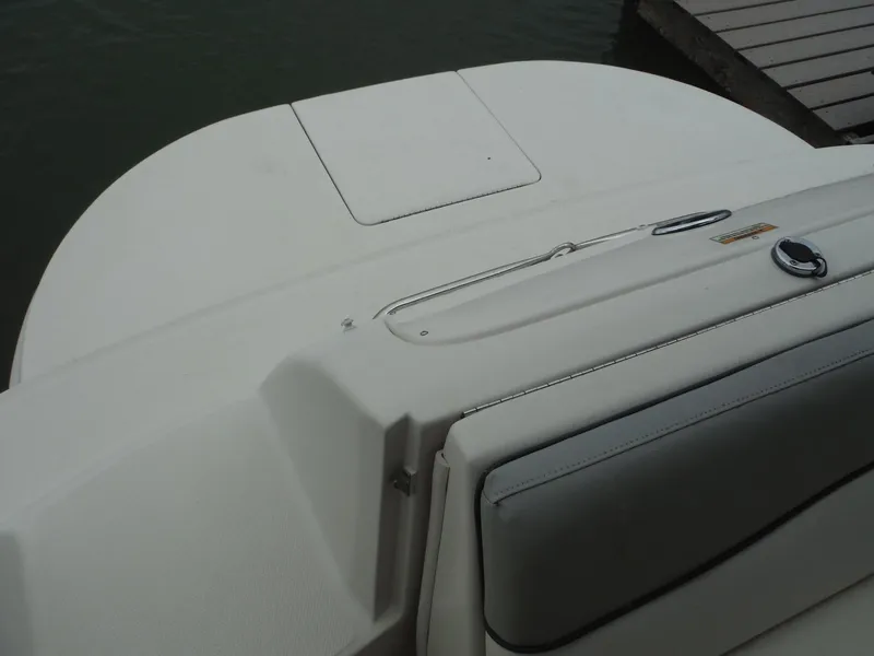 Slide: The Image of 2007 Sea Ray 240 Sundeck boat stern view near dock. - 30
