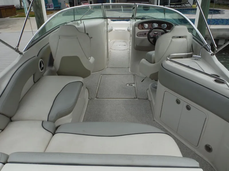 Slide: The Image of 2007 Sea Ray 240 Sundeck interior with spacious seating and modern dashboard. - 7