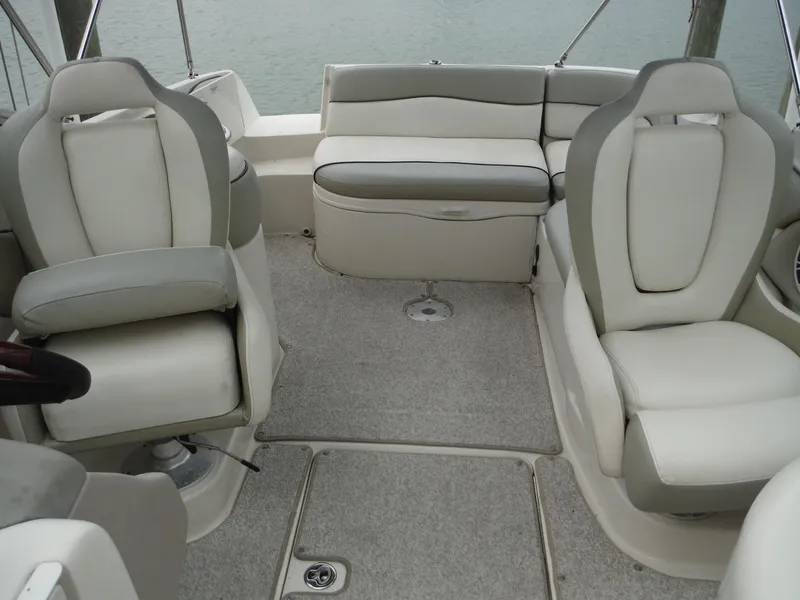 Slide: The Image of Interior of 2007 Sea Ray 240 Sundeck boat with white and gray seating. - 24