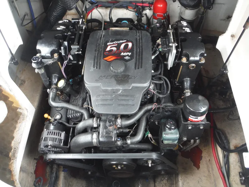 Slide: The Image of 2007 Sea Ray 240 Sundeck engine compartment with MerCruiser 5.0 MPI engine. - 16