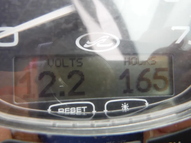 Slide: The Image of Close-up of 2007 Sea Ray 240 Sundeck gauge showing 12.2 volts and 165 hours. - 15