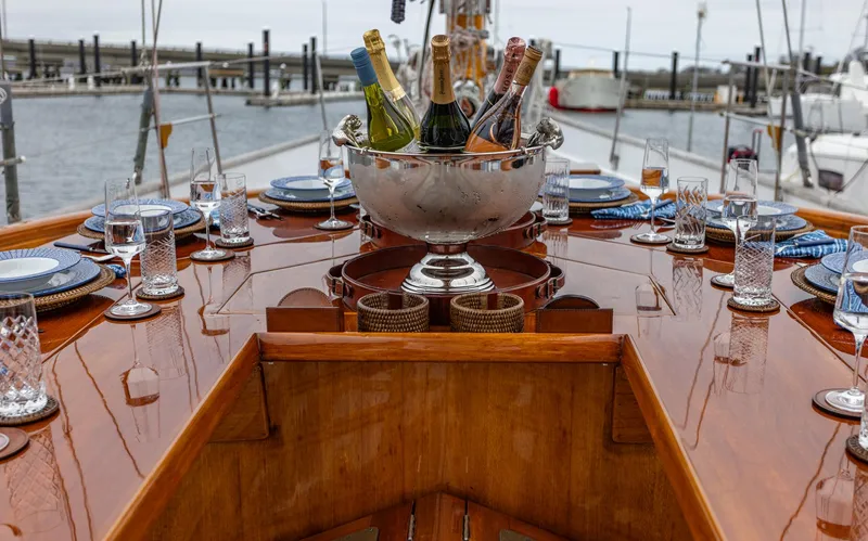 Slide: The Image of Elegant dining setup on 1929 Lyman-Morse Staysail Schooner with champagne bucket. - 19
