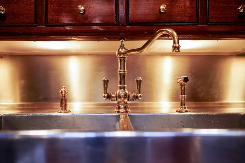 Slide: The Image of Vintage brass faucet and sink on 1929 Lyman-Morse Staysail Schooner. - 37