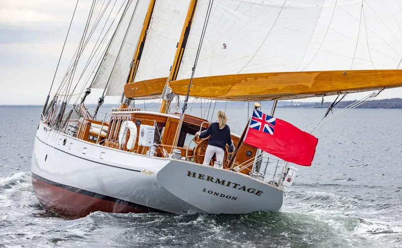 Slide: The Image of 1929 Lyman-Morse Staysail Schooner Hermitage sailing with red ensign flag. - 55