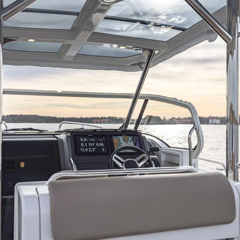 Slide: The Image of Interior view of 2024 Nimbus Tender 9 boat with modern dashboard and navigation system. - 3