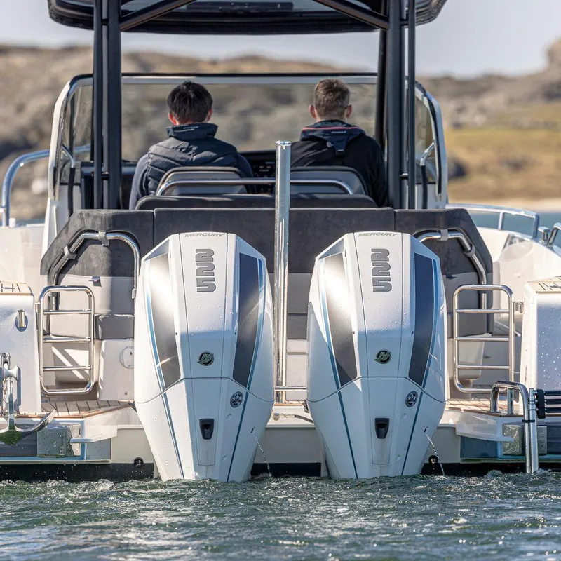 Slide: The Image of 2024 Nimbus Tender 9 boat with dual outboard engines on water. - 5