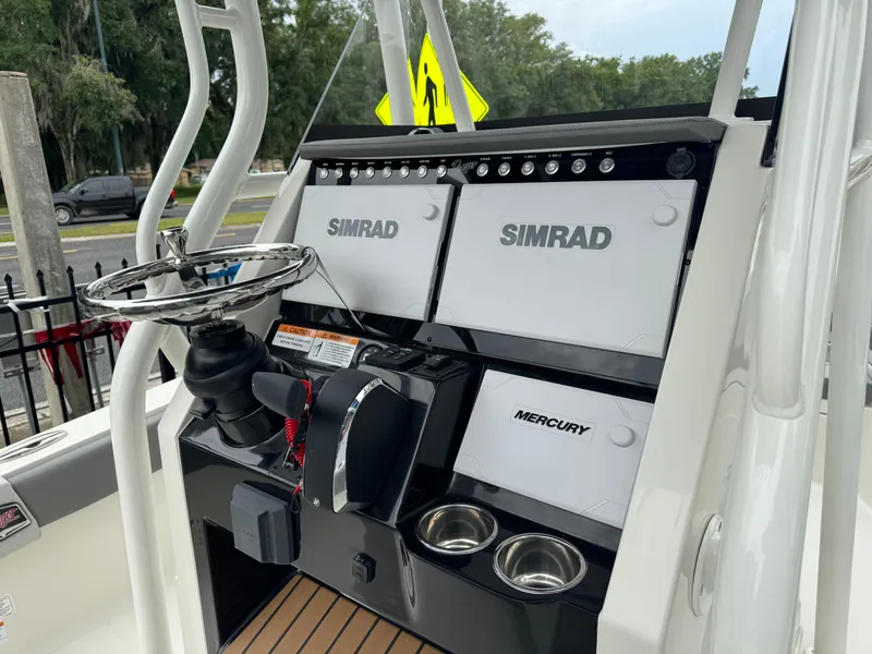 Slide: The Image of 2024 Ranger 2510 boat console with Simrad and Mercury electronics. - 14