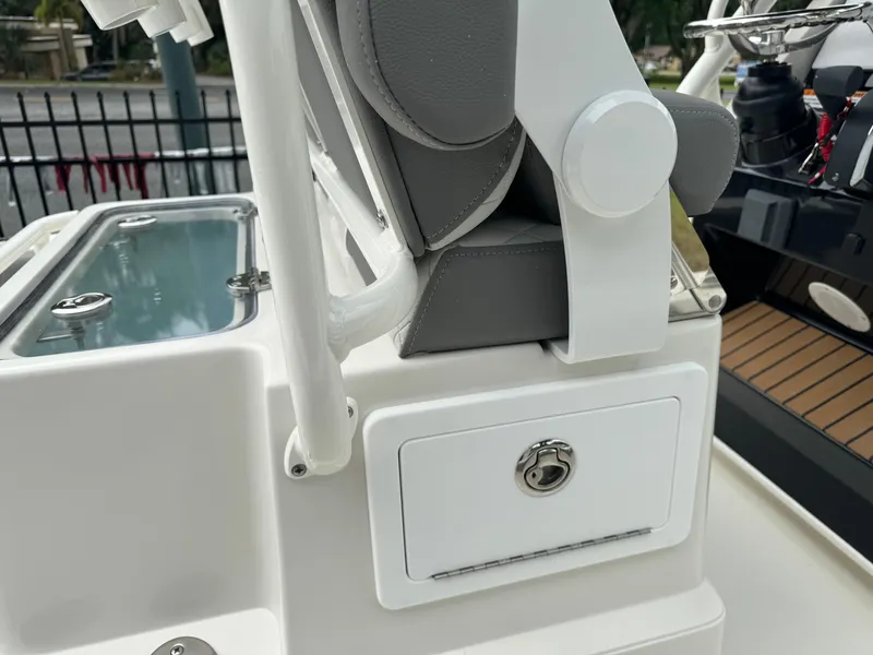 Slide: The Image of 2024 Ranger 2510 boat seat and storage compartment close-up. - 15