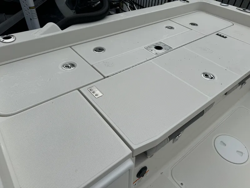 Slide: The Image of 2024 Ranger 2510 boat deck with storage compartments and fixtures. - 17