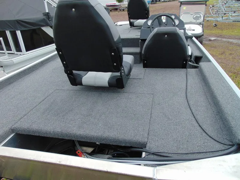 Slide: The Image of 2024 Crestliner 1600 Storm boat interior with seating and steering console. - 3