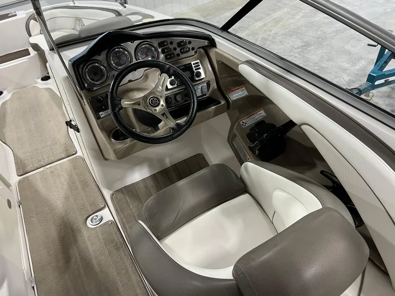 Slide: The Image of 2013 Yamaha Boats 242 Limited S interior dashboard and steering wheel. - 10