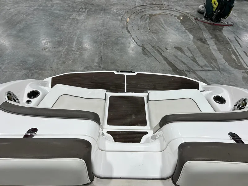 Slide: The Image of 2013 Yamaha Boats 242 Limited S interior with seating and cup holders. - 11