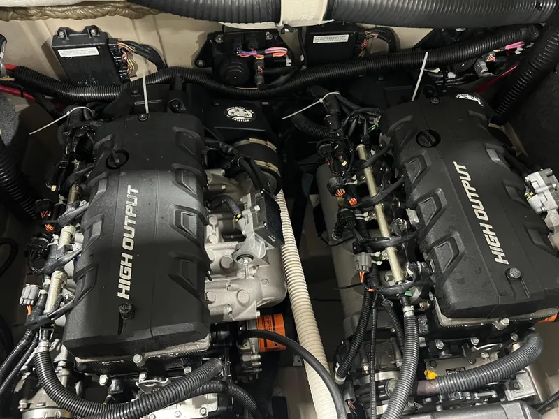 Slide: The Image of Twin high-output engines in a 2013 Yamaha Boats 242 Limited S. - 12