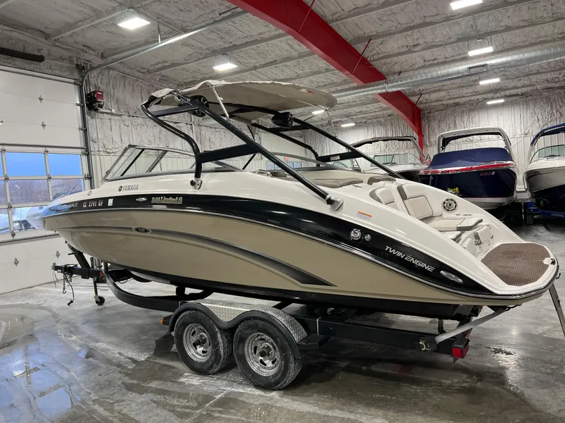 Slide: The Image of 2013 Yamaha Boats 242 Limited S in indoor storage on a trailer. - 4