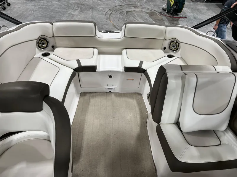 Slide: The Image of 2013 Yamaha Boats 242 Limited S interior with white and brown seating. - 7