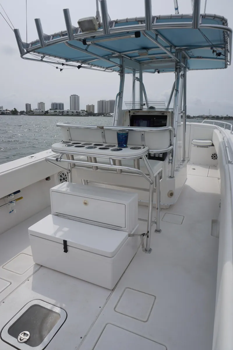 Slide: The Image of 2006 Contender 36 Cuddy boat interior with fishing setup and ocean view. - 13