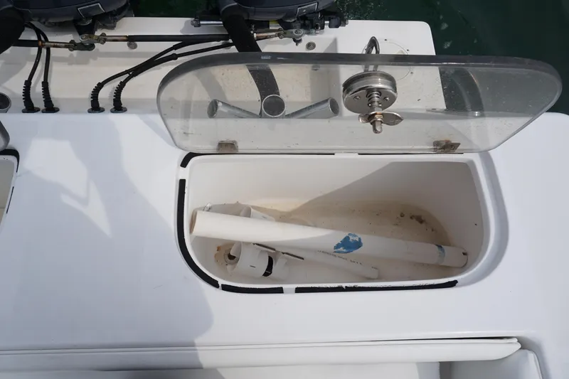 Slide: The Image of Open storage compartment on a 2006 Contender 36 Cuddy boat. - 16