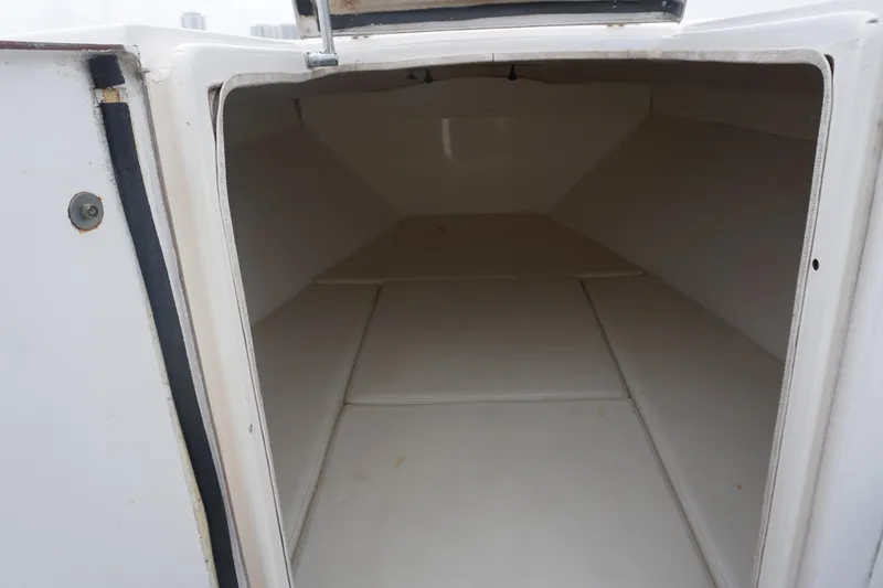 Slide: The Image of 2006 Contender 36 Cuddy interior cabin space, white and spacious. - 18