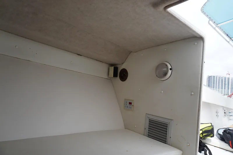 Slide: The Image of Interior cabin of a 2006 Contender 36 Cuddy boat with ventilation and lighting. - 19