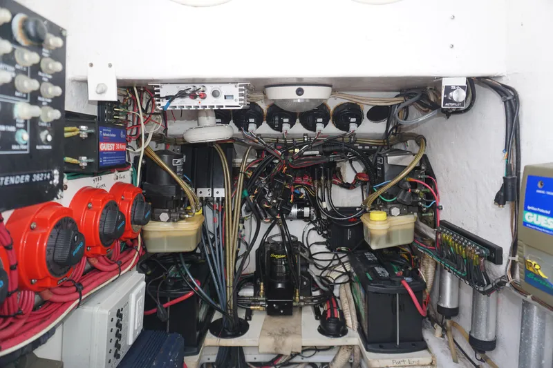 Slide: The Image of 2006 Contender 36 Cuddy engine room with wiring and electrical components. - 22