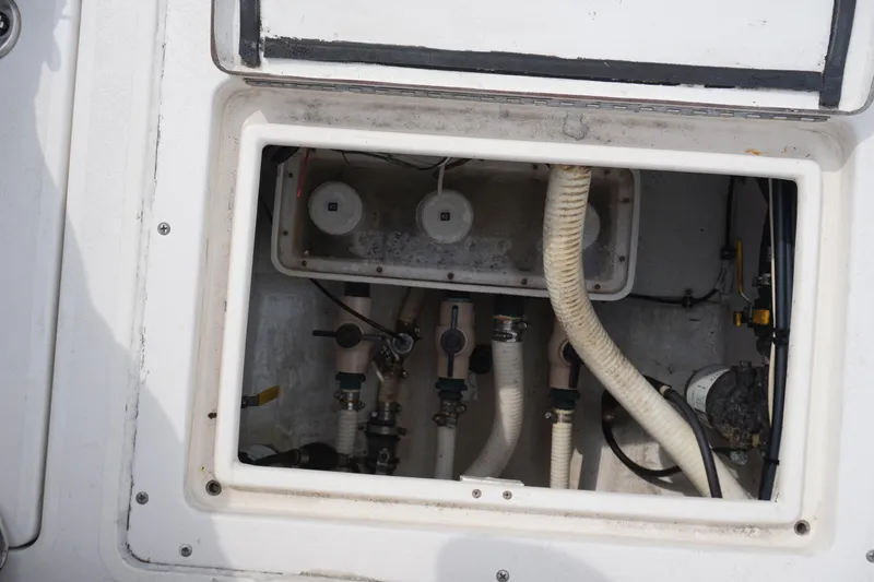 Slide: The Image of 2006 Contender 36 Cuddy boat plumbing and wiring compartment. - 28