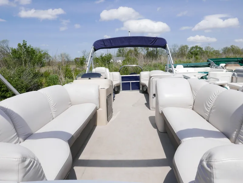 Slide: The Image of 2017 Sweetwater SWPE 255 SB pontoon boat with spacious seating and canopy. - 2