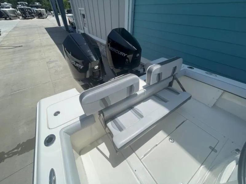 Slide: The Image of 2020 ShearWater 270 Carolina Flare boat with twin Mercury engines and foldable seating. - 10