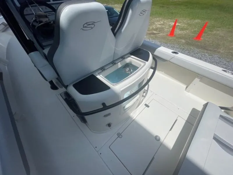 Slide: The Image of 2020 ShearWater 270 Carolina Flare boat interior with seating and storage. - 13